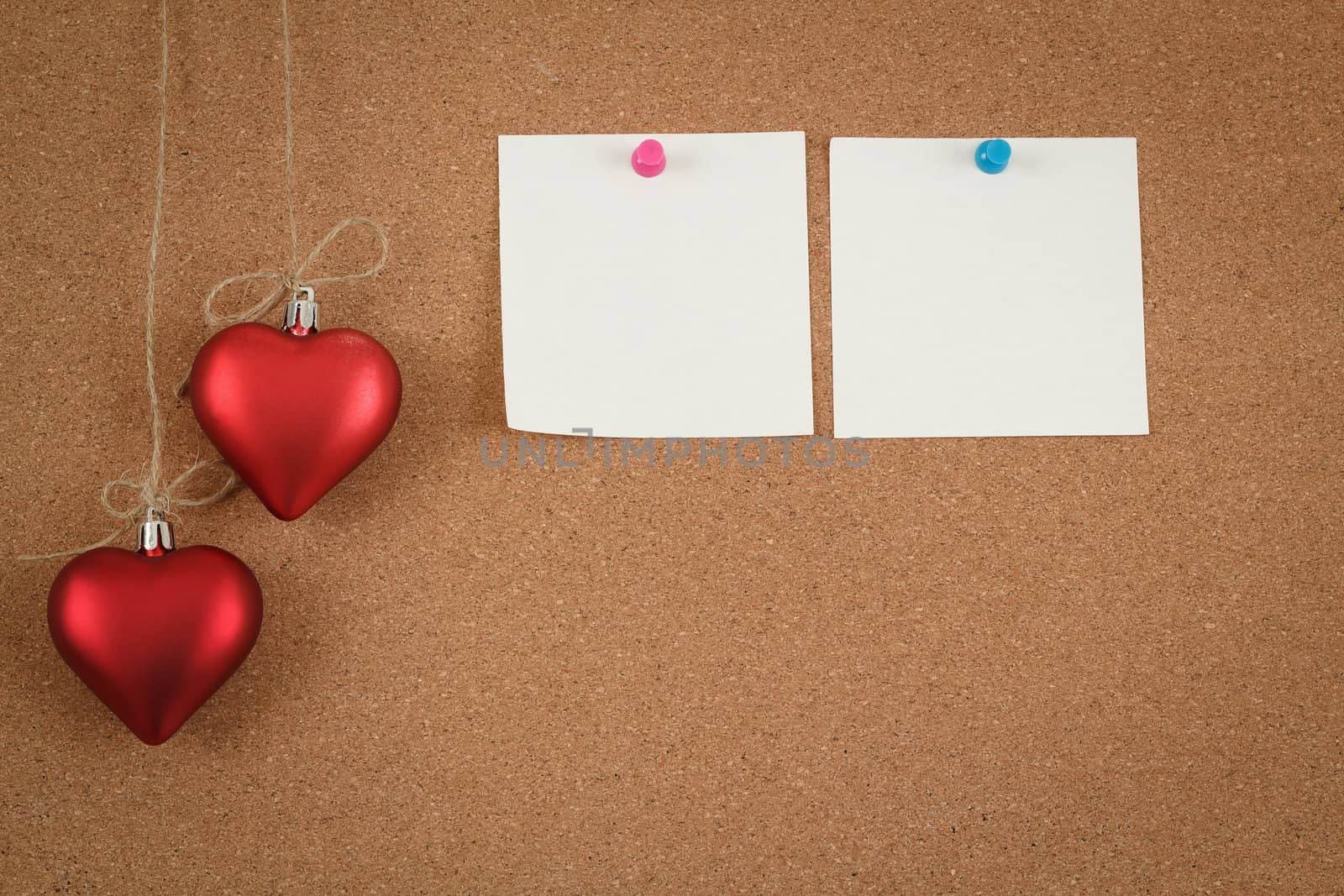 empty cork board for valentine message on wooden background
