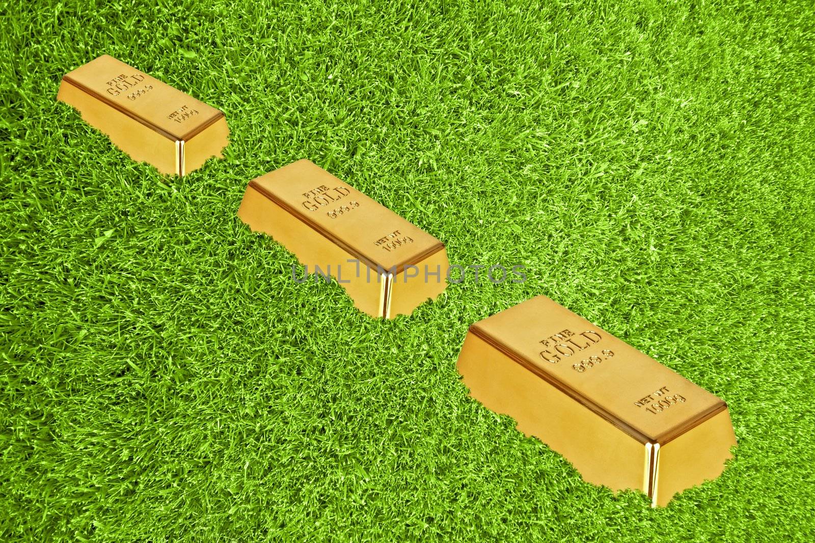 Gold bars in green grass