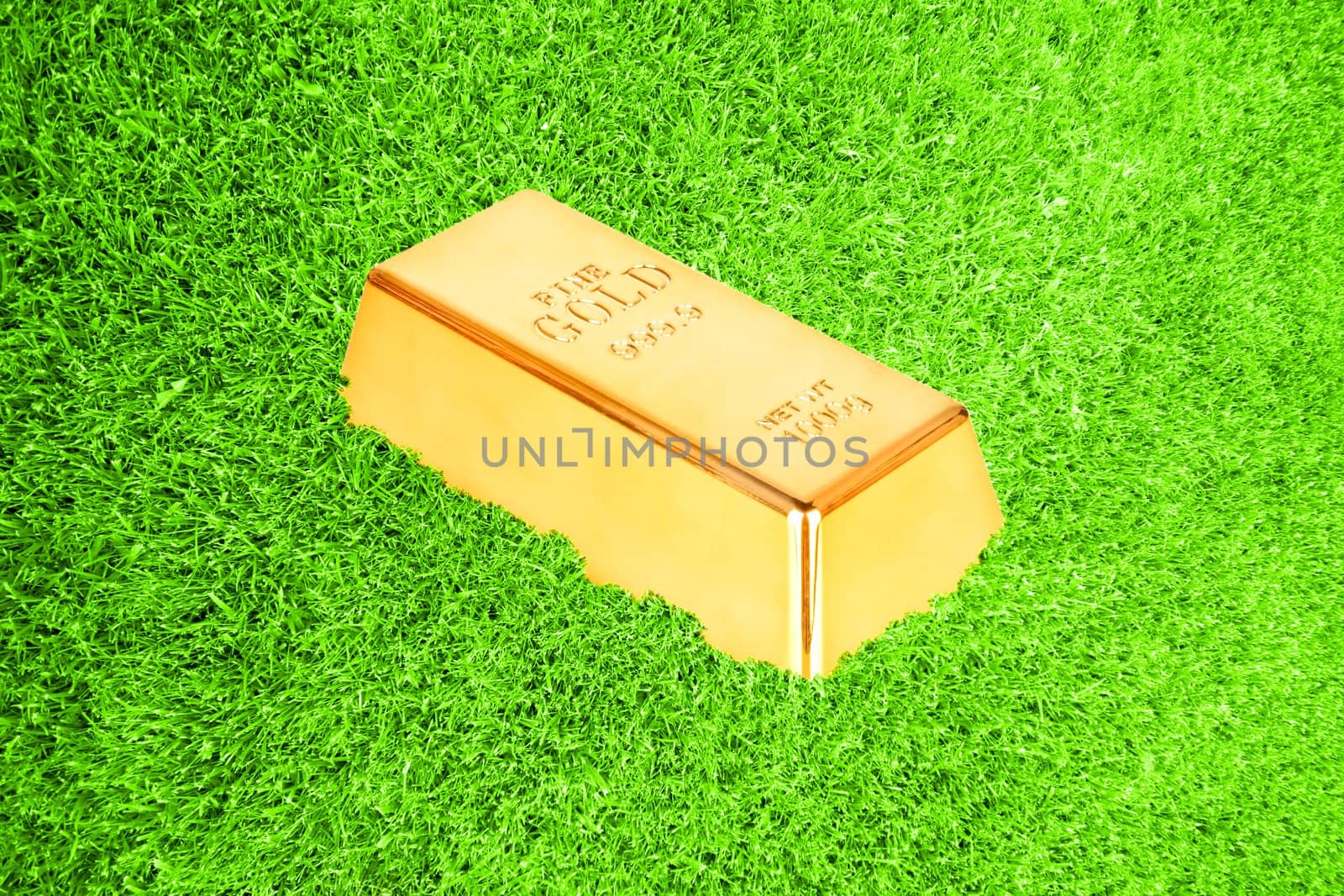 Gold bar in green grass