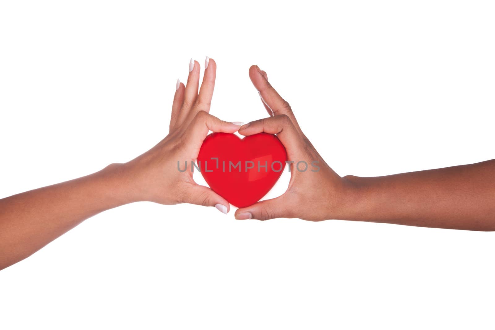 african Man and woman holding red heart in hands isolated on white