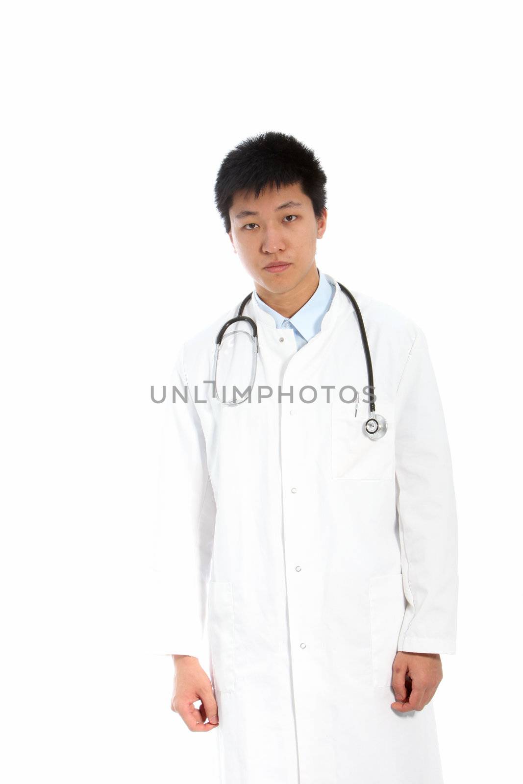 Unhappy young male doctor wearing a medical robe and looking at camera