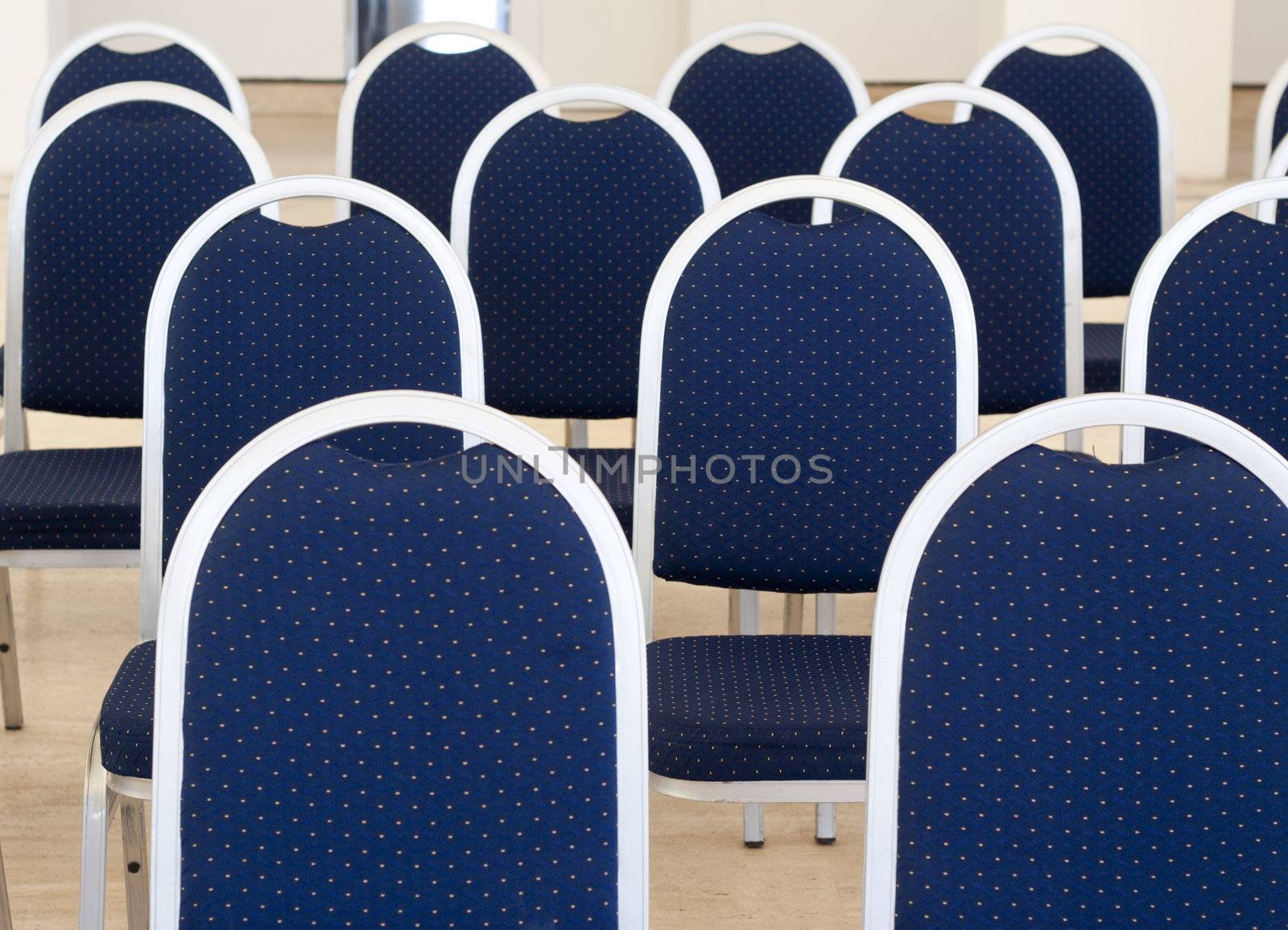 close up of blue empty conference chairs