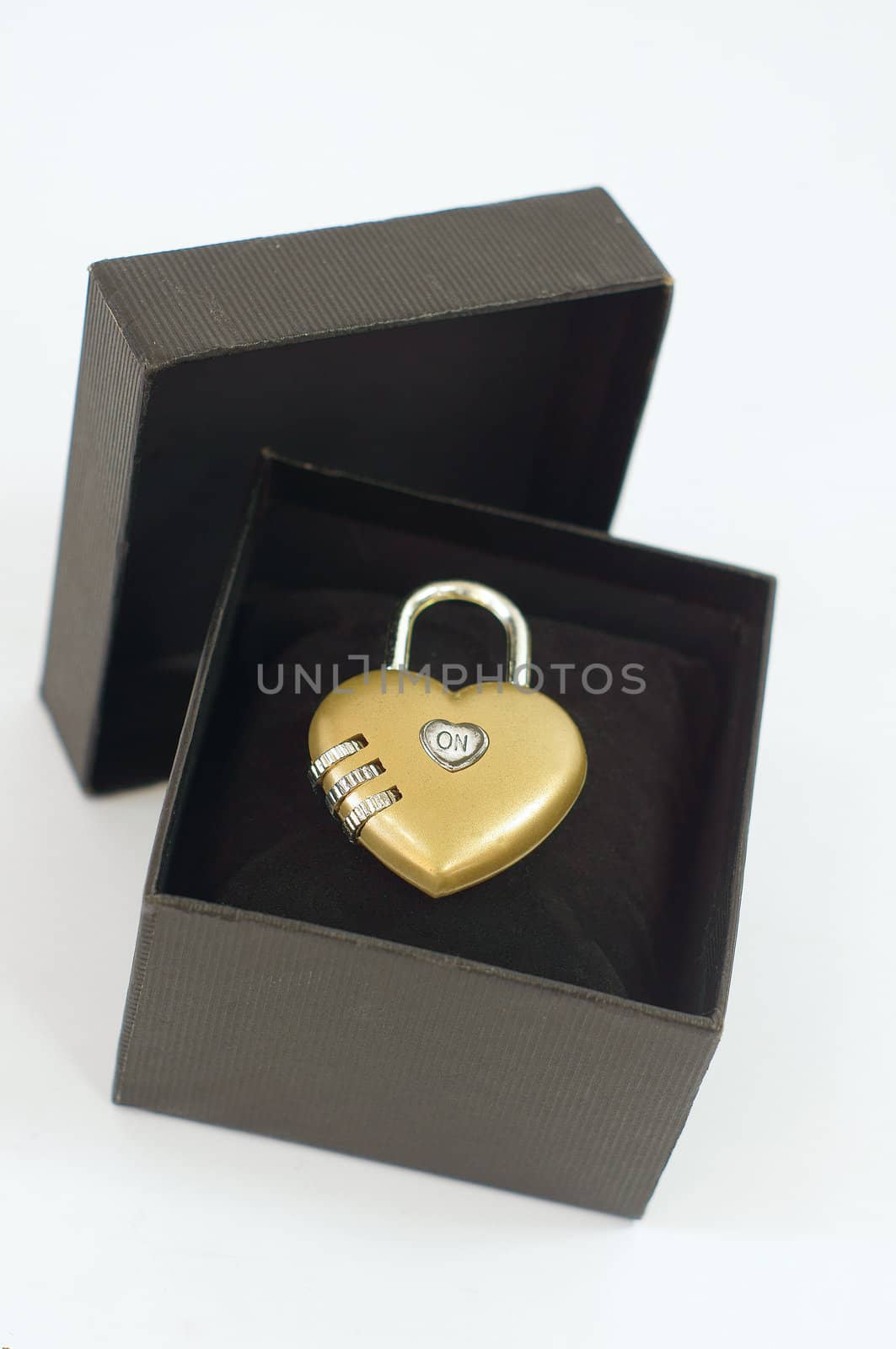 A heart shaped lock inside a gift box
