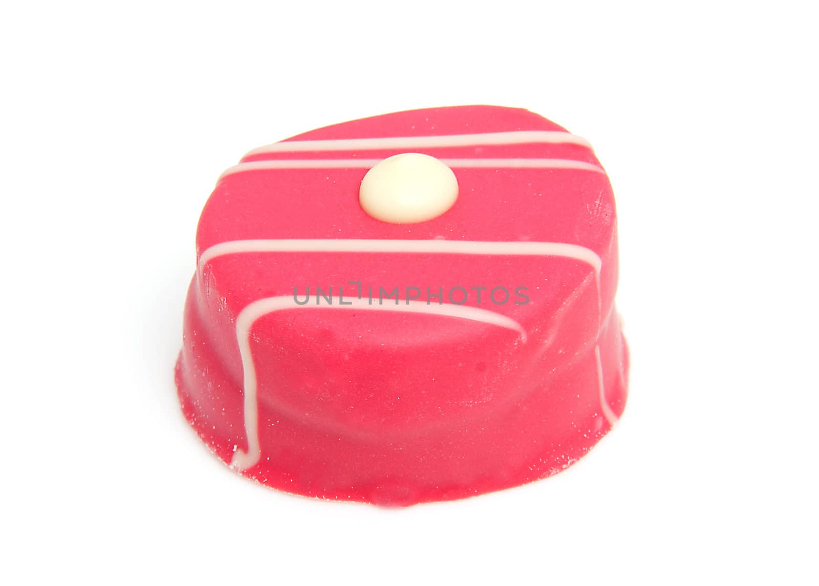 delicious pink petit four over white background