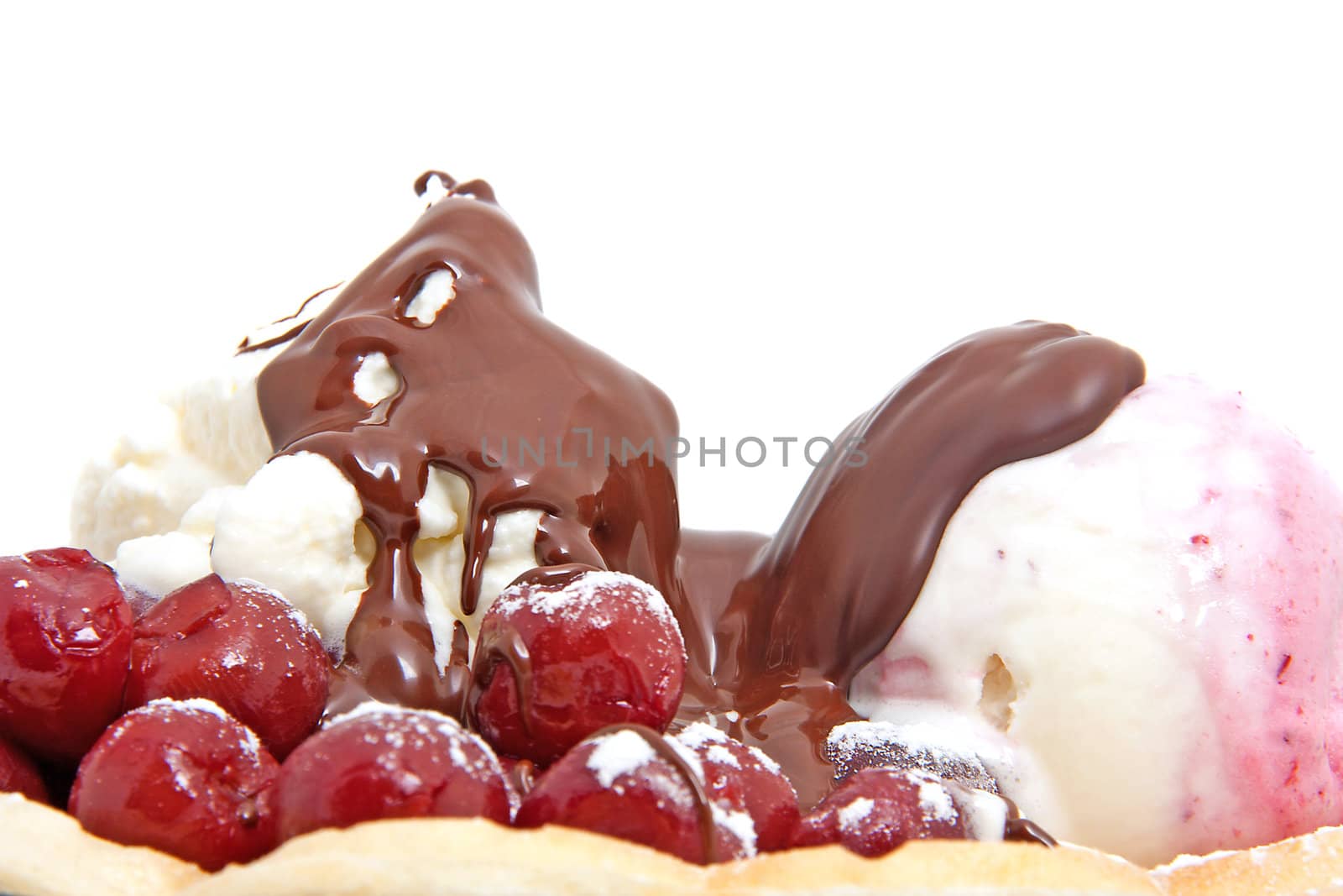 closeup of delicious dessert with  ice cream , chocolate sauce and cherries over white background