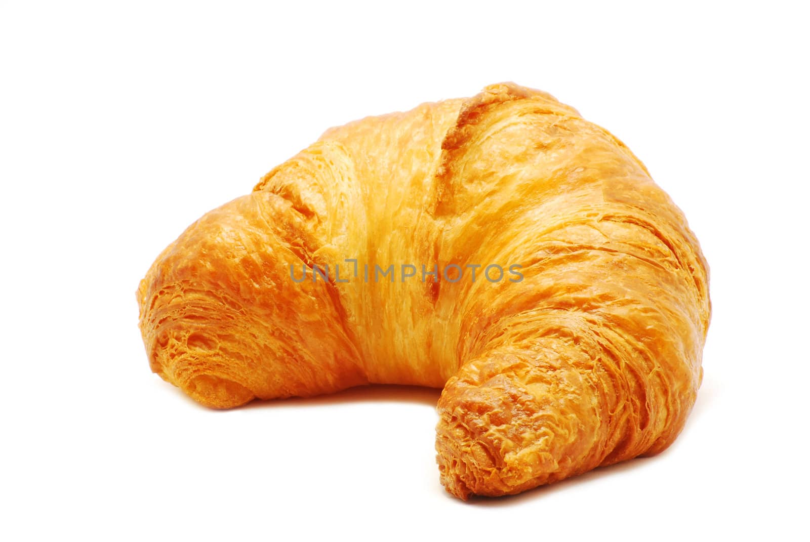 Fresh and tasty croissant over white background