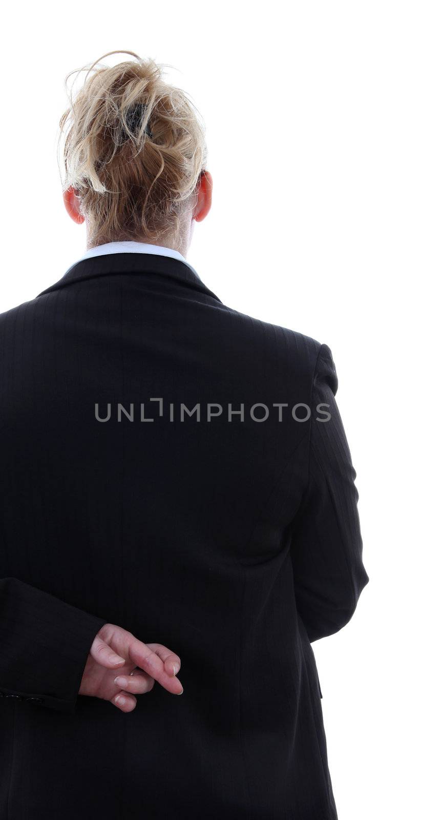 Liar businesswoman with crossed fingers at back over white background