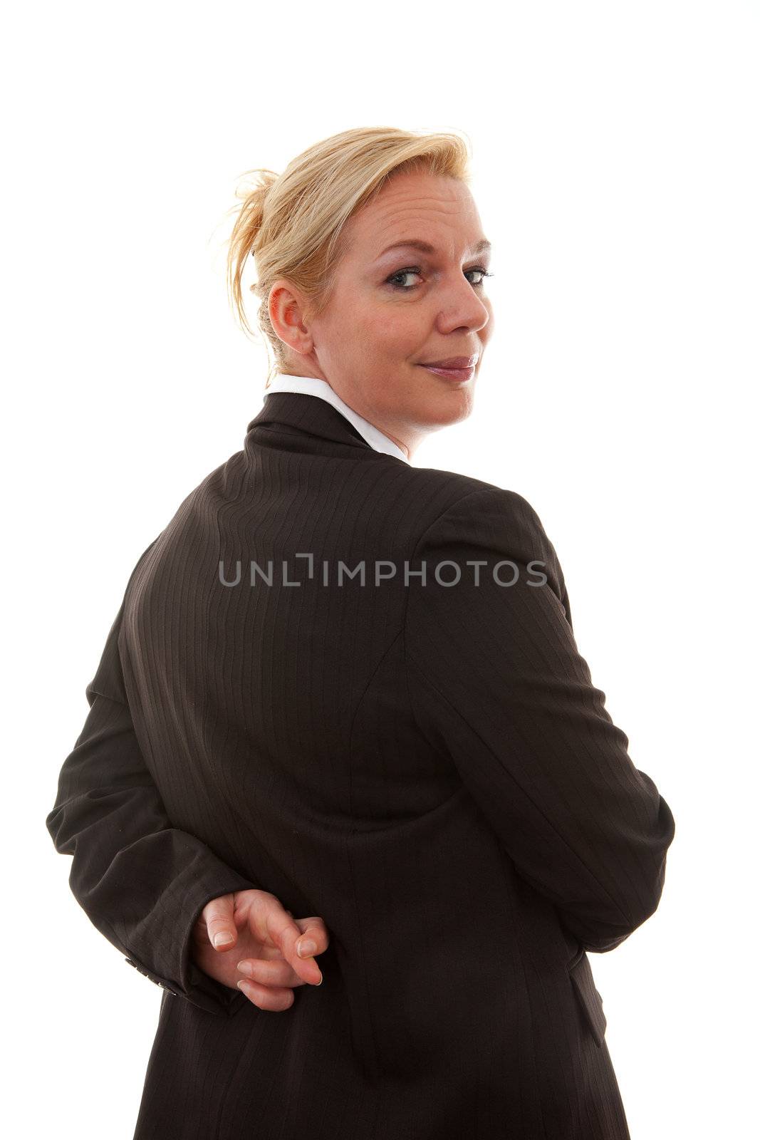 Liar businesswoman with crossed fingers at back over white background