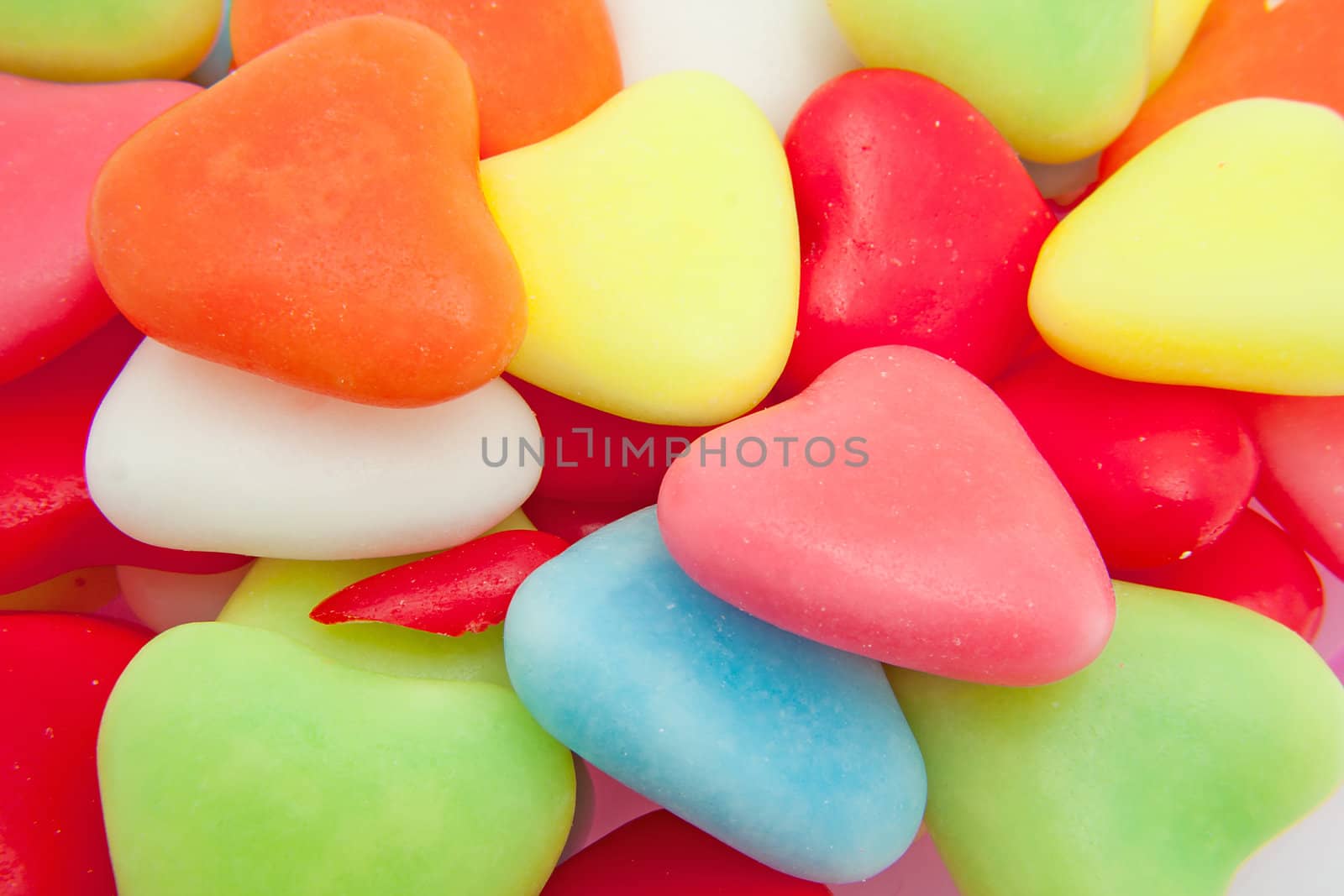 candy in shape of hearts can be used as background