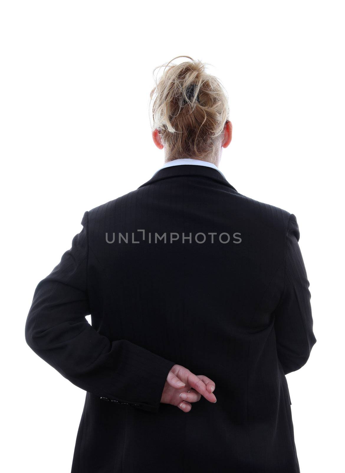 Liar businesswoman with crossed fingers at back over white background