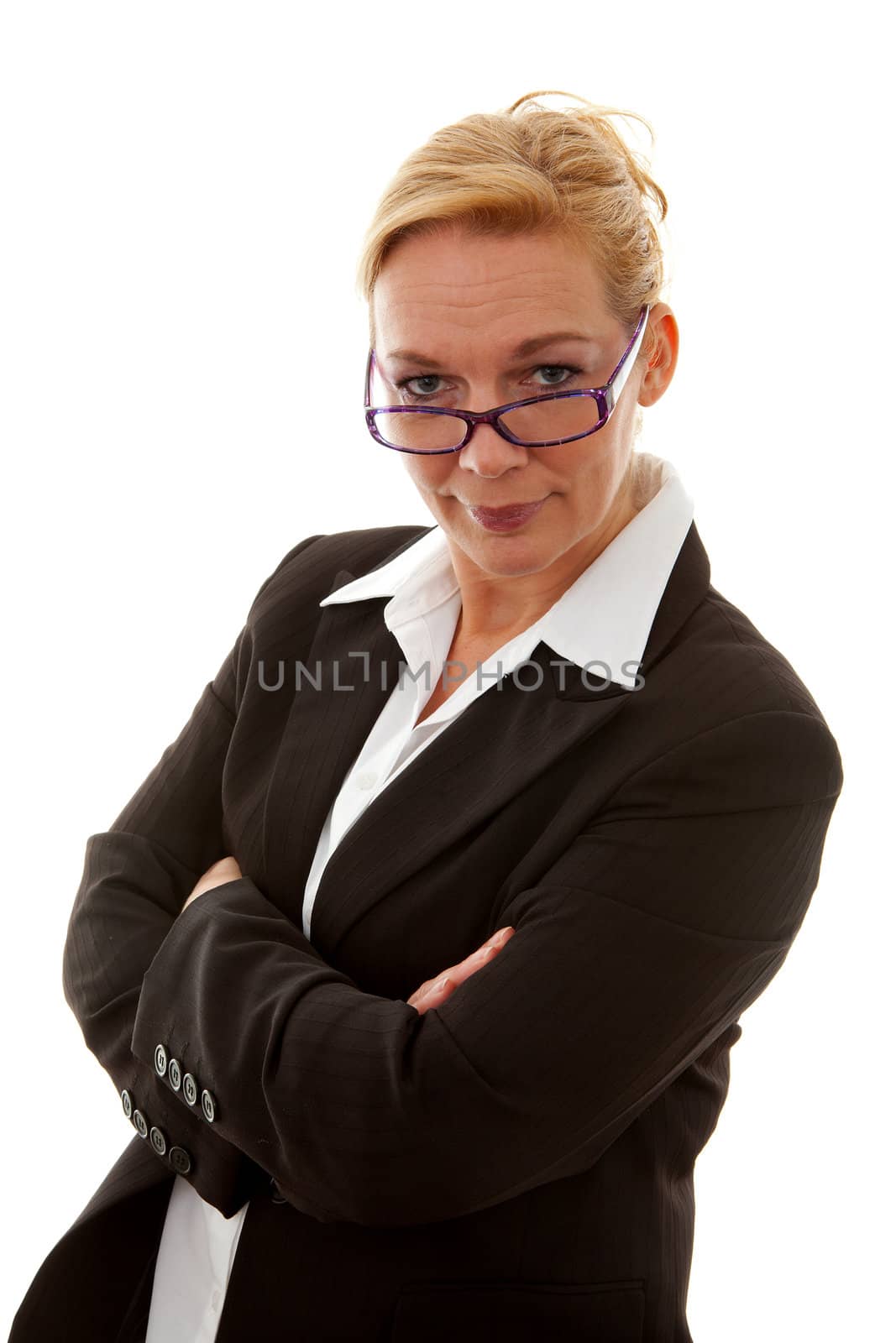 Businesswoman is looking at you with her arms crossed over white background