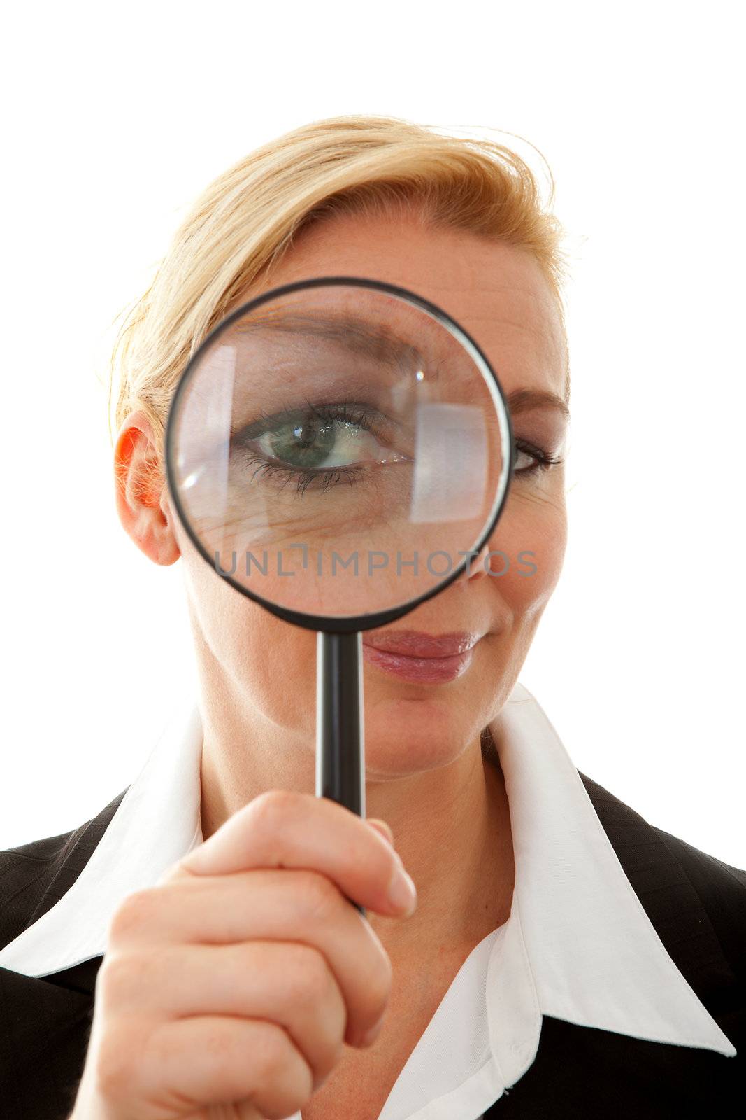 business woman with magnifying glass fto the eye over white background