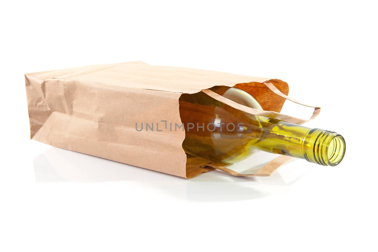 paper bag with bottle inside over white background