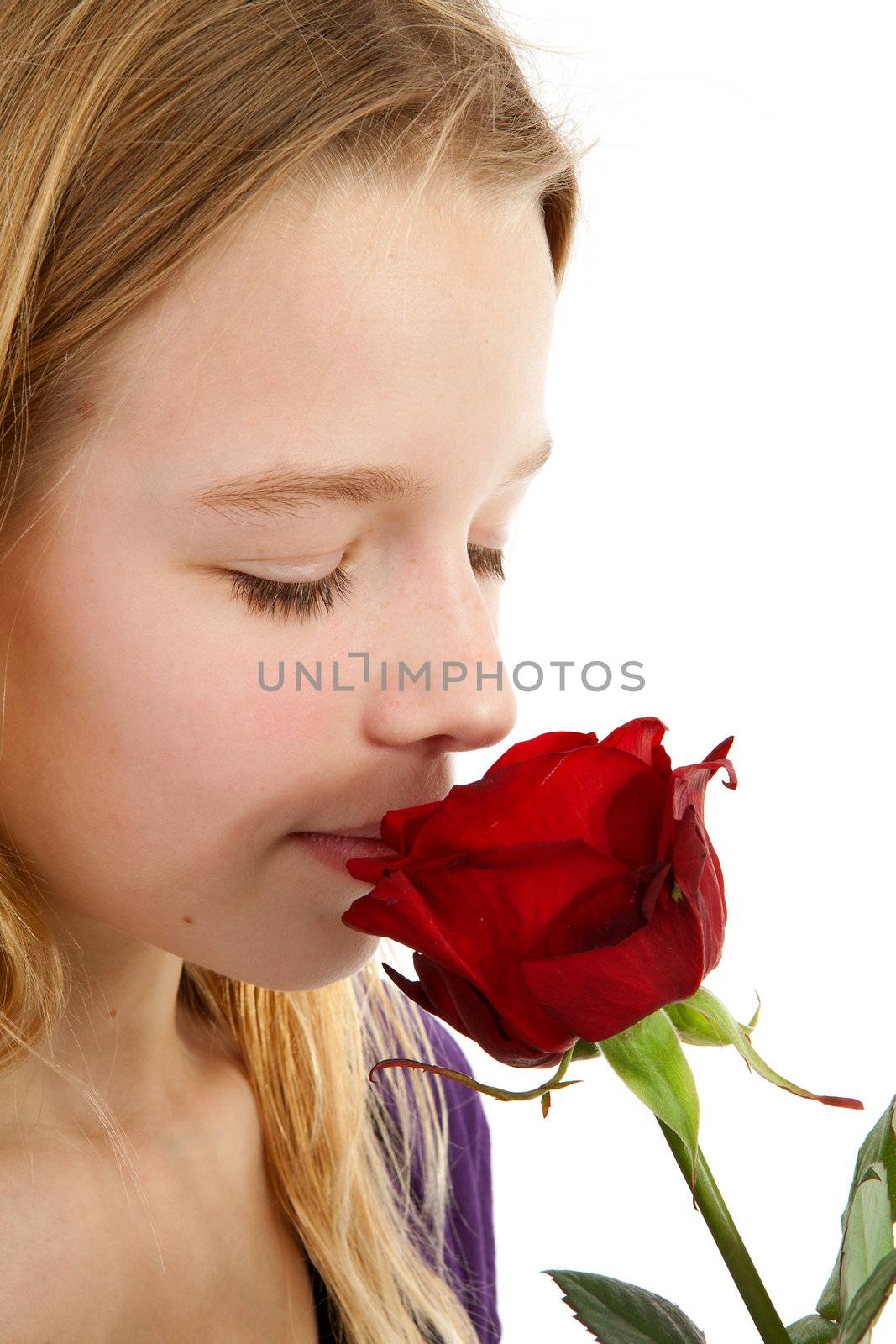 young girl smelling a red rose by sannie32