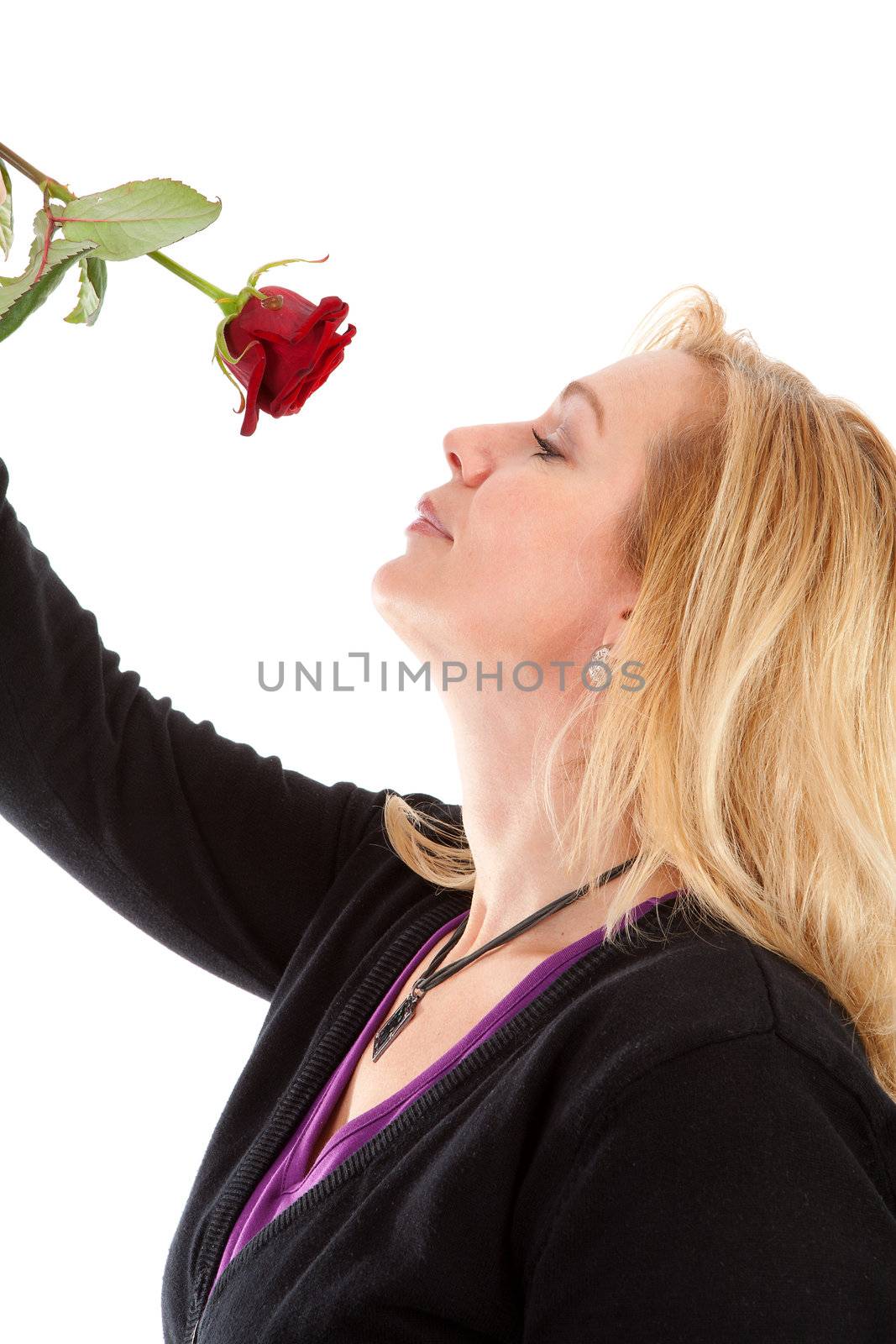 woman smelling a red rose by sannie32
