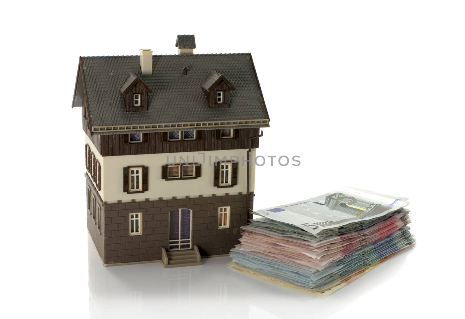 house with euro paper money isolated on white