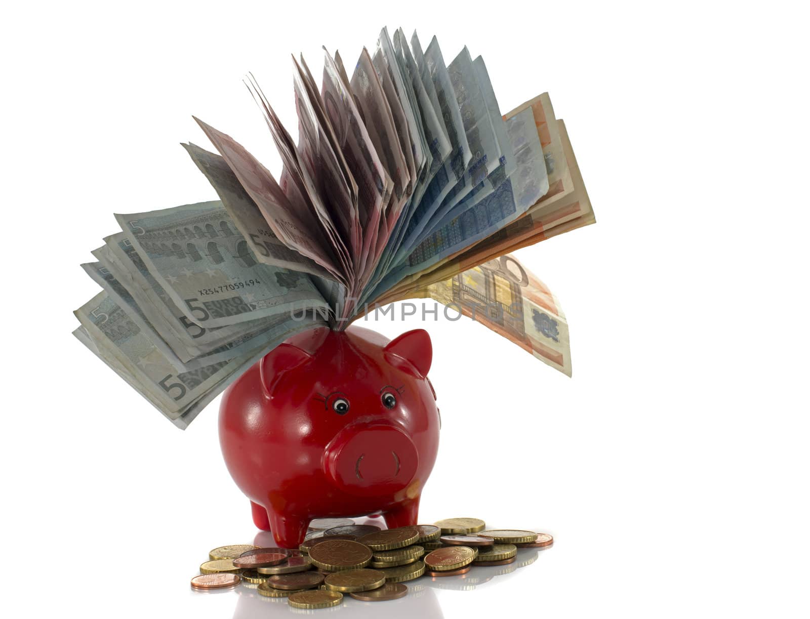 red money pig with euro money isolated on white