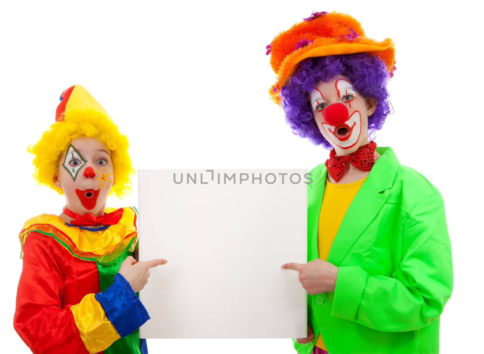 Two girl clowns holding empty text board over white background