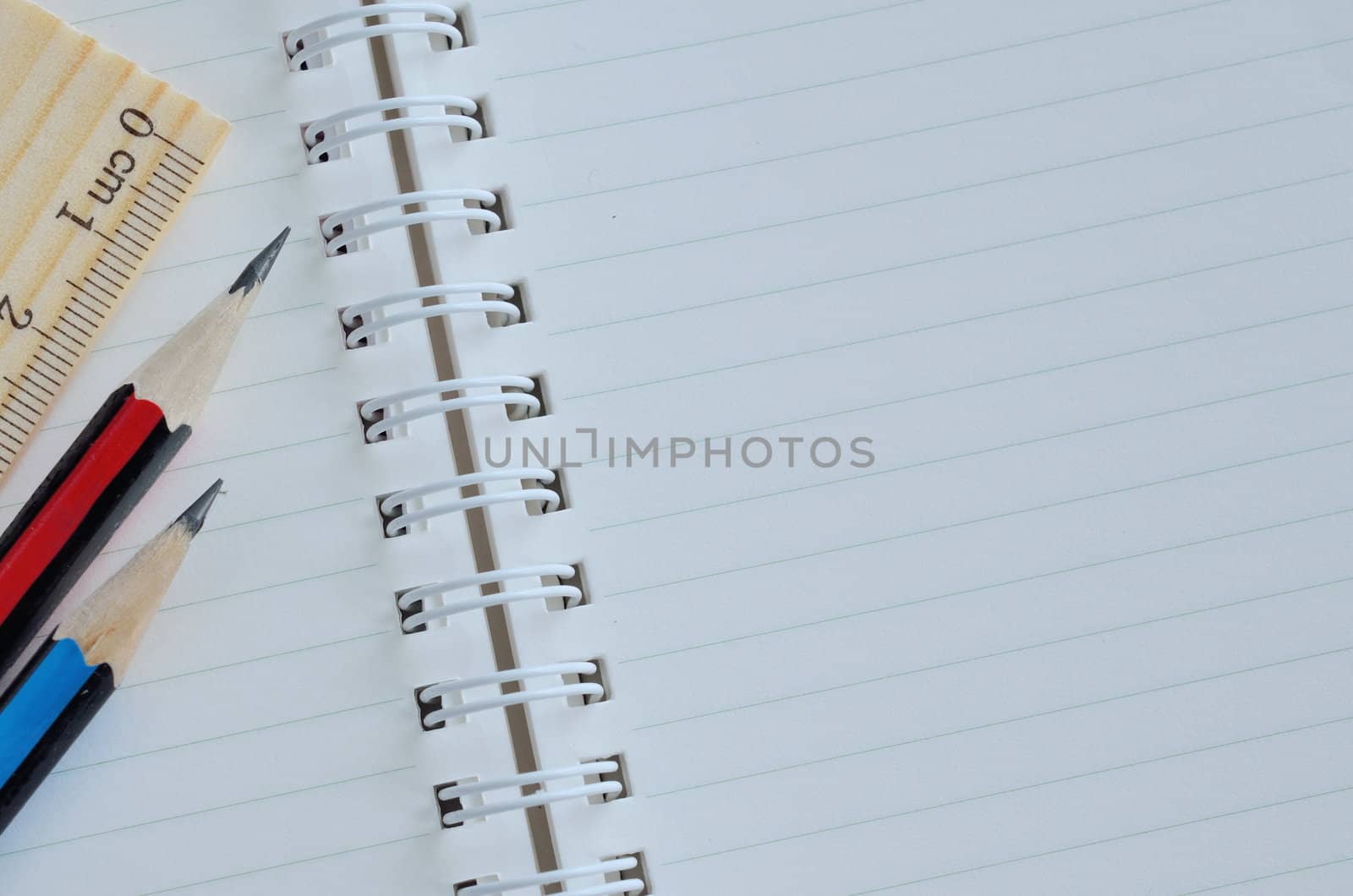 Blank notebook and pencil