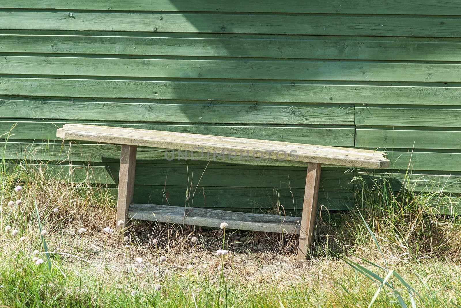 Wooden settee in front of a danish summer residence