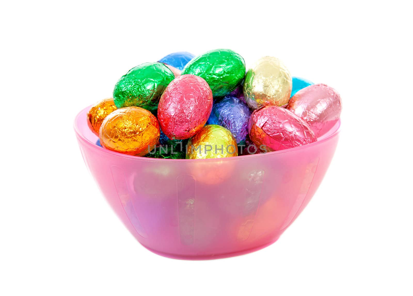 pink bowl with colorful easter eggs over white background