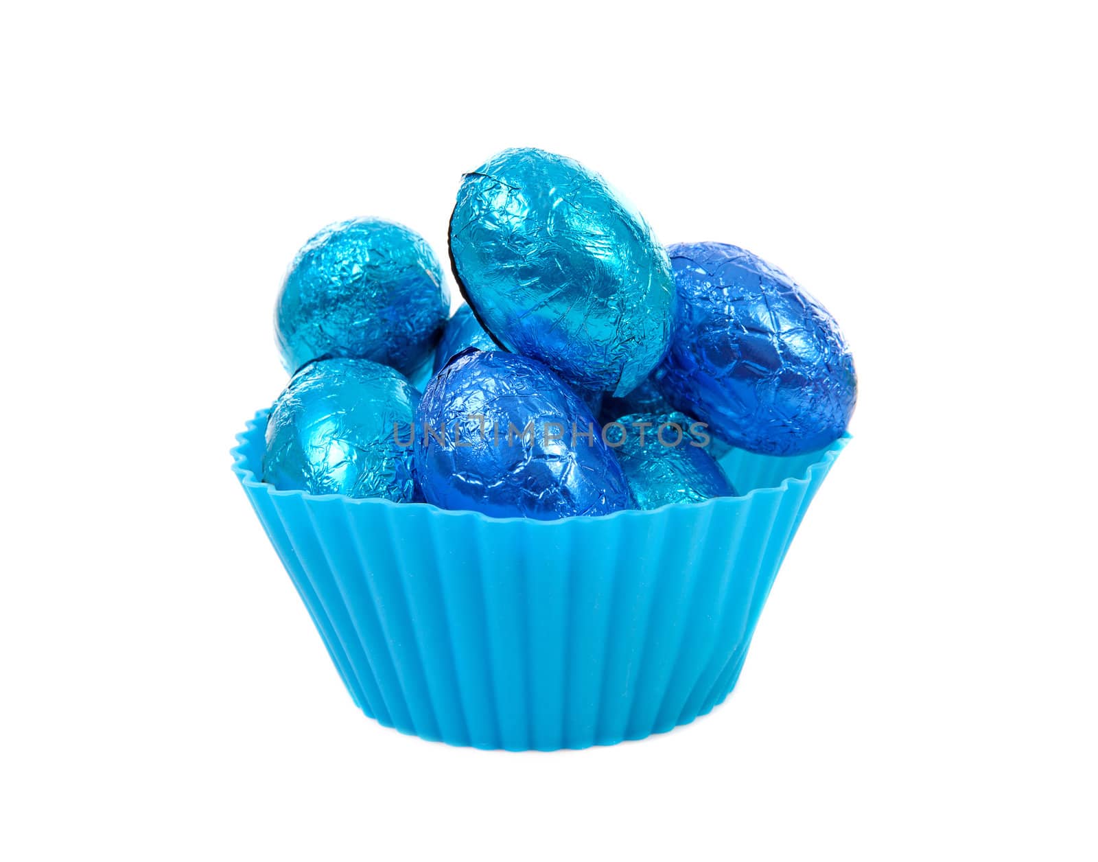 blue bowl with easter eggs over white background