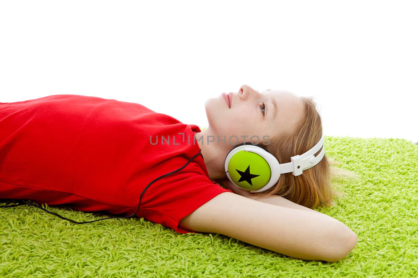 girl is listening to music with headphones on over white background