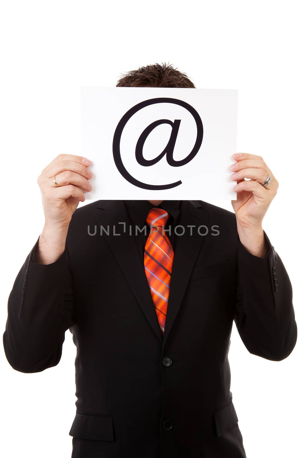 Businessman is holding a at sign, isolated on white background