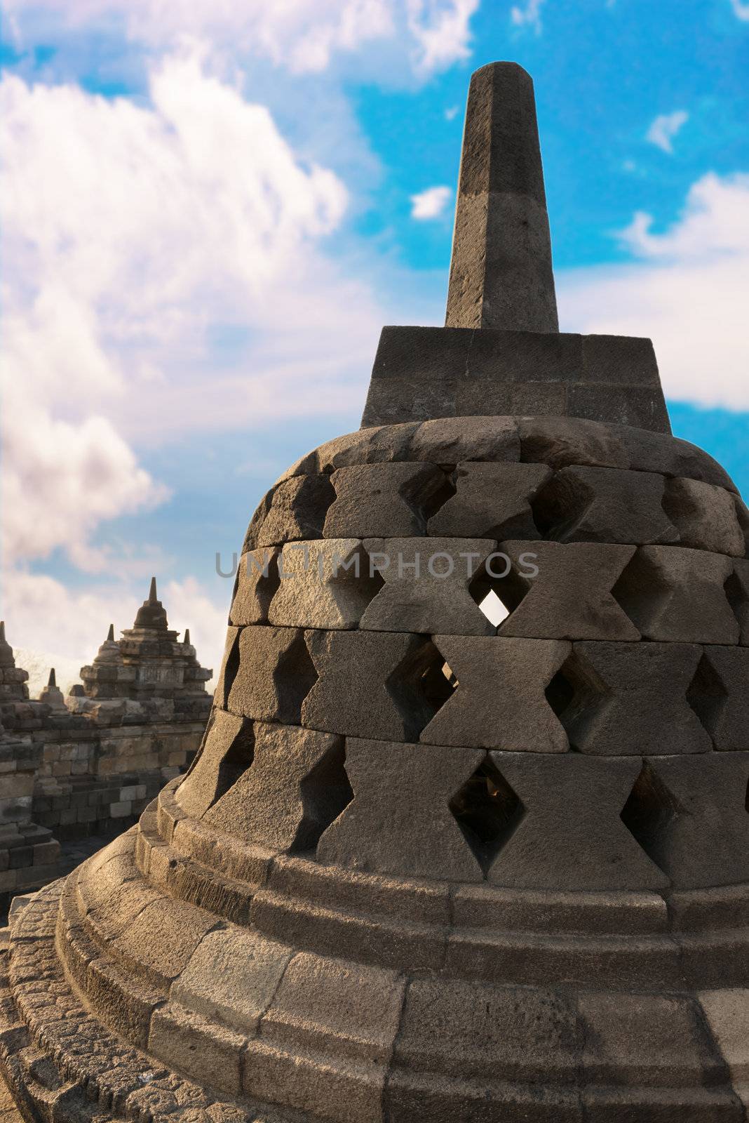 Stupa with hidden Buddha statue inside in Borobudur, or Barabudur, temple Jogjakarta, Java, Indonesia at sunrise. It is a 9th-century Mahayana temple and the biggest  Buddhist Temple in Indonesia.