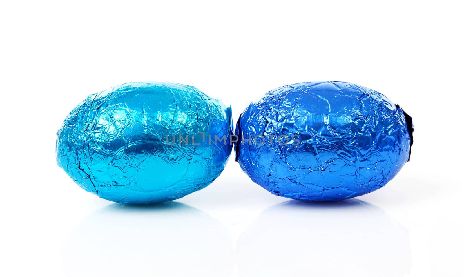 Two blue easter eggs over white background