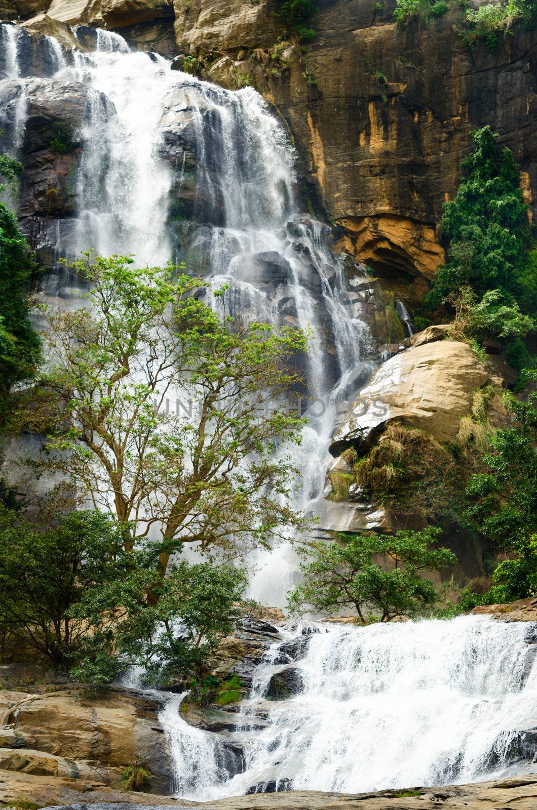 Big waterfall with green trees, Nuwara Eliya, Sri Lanka