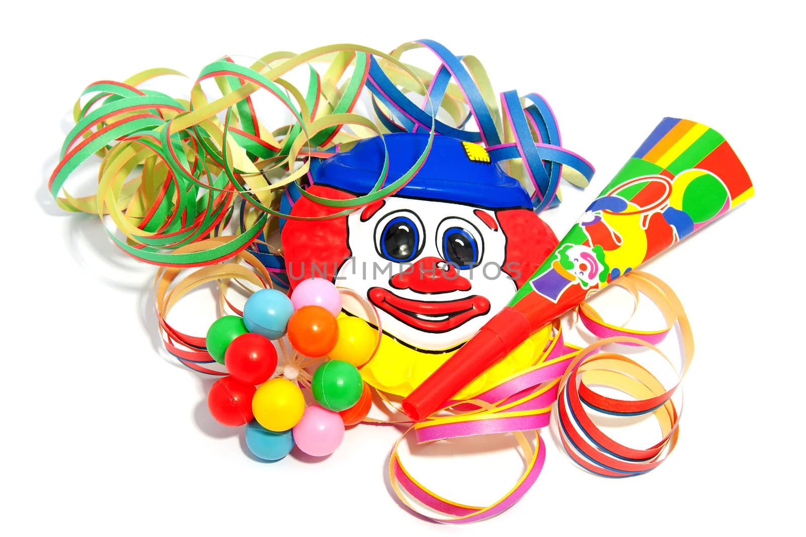 colorful party accessories with streamers over white background