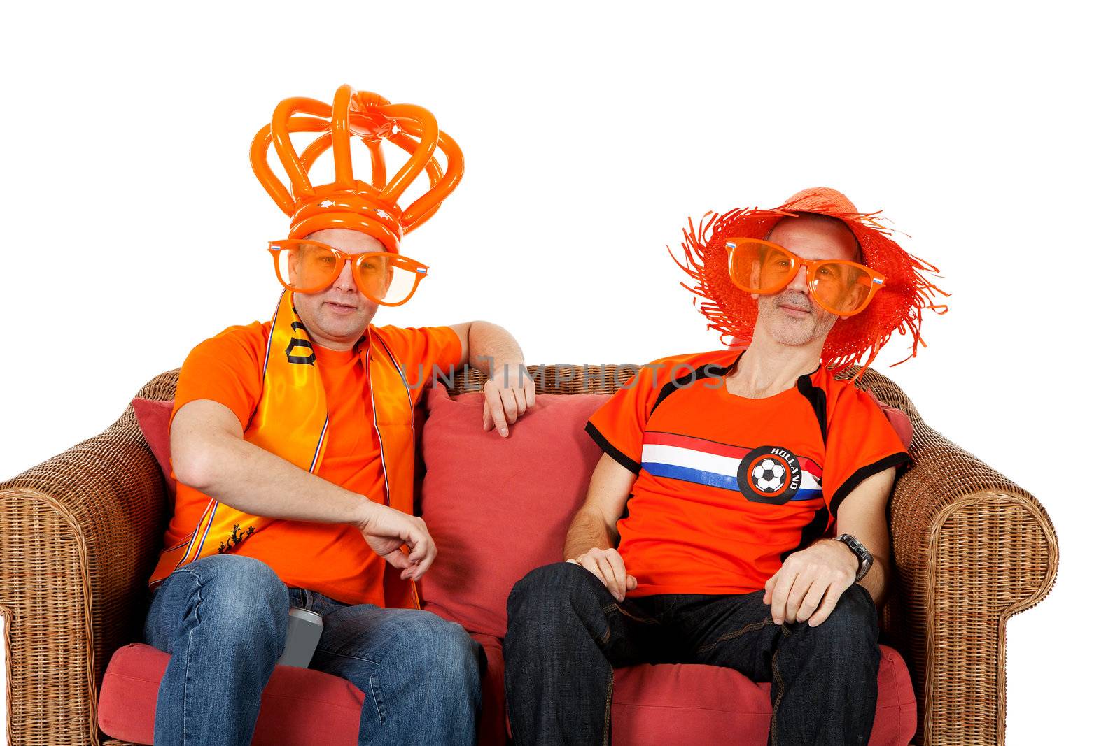 Two Dutch soccer fan watching game over white background