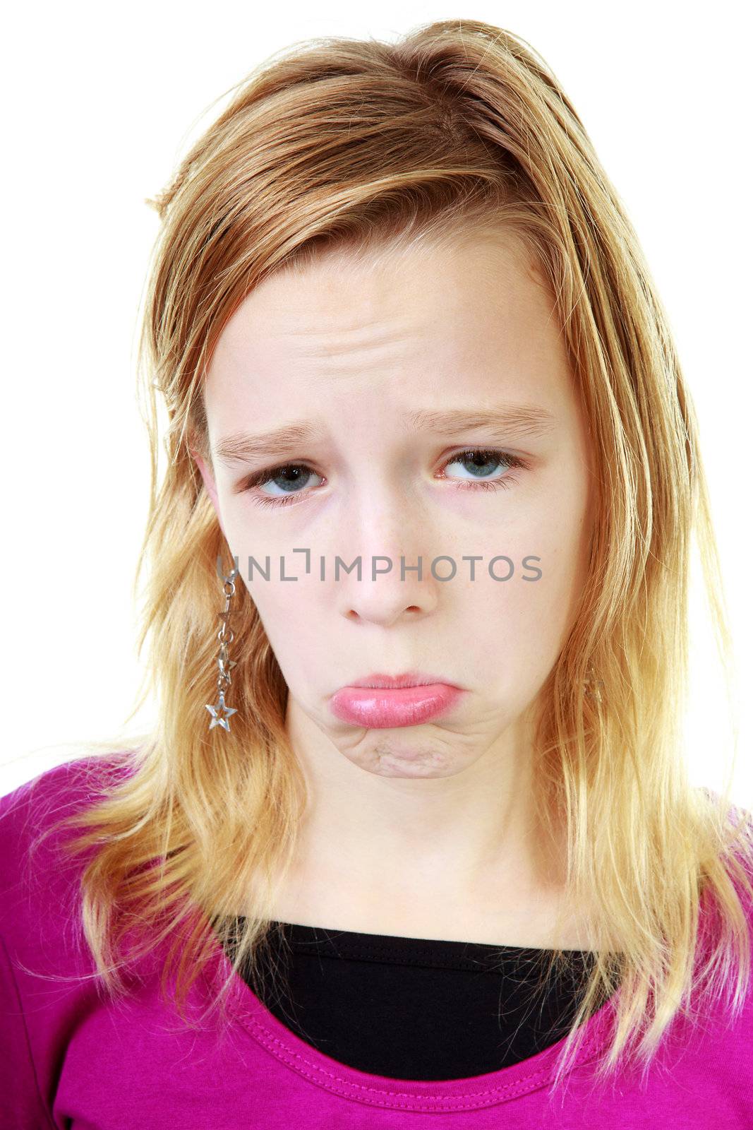 Girl makes sad face over white background