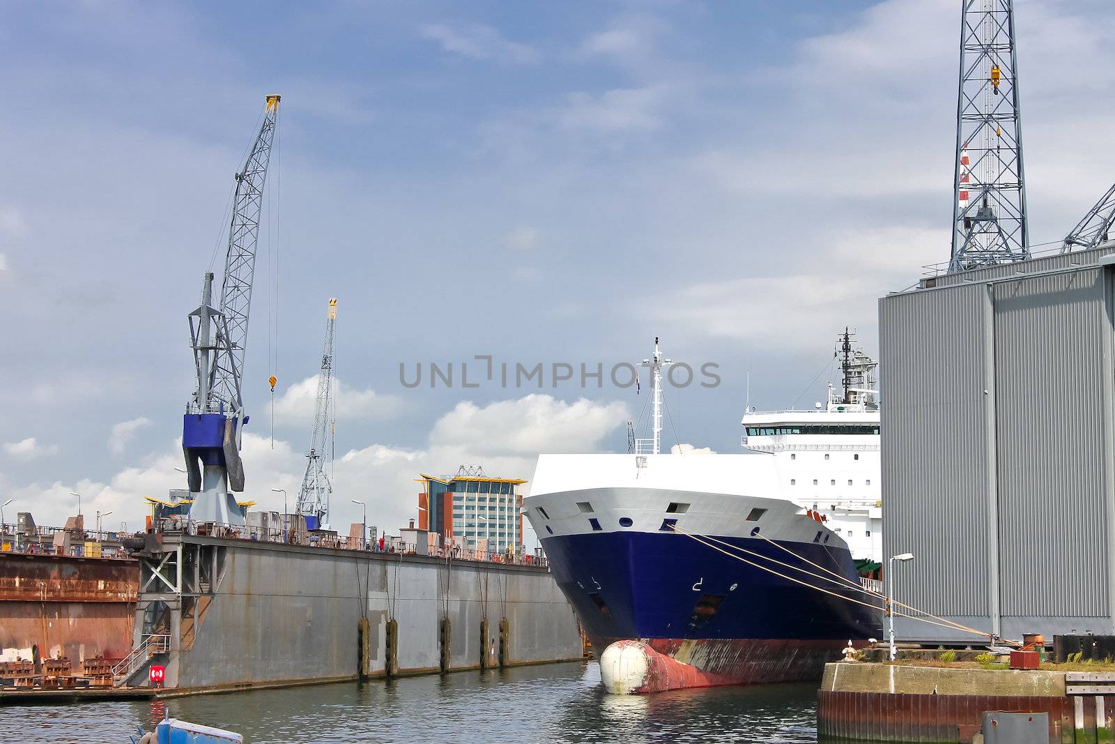 Industrial landscape. Ship and crane in shipyard