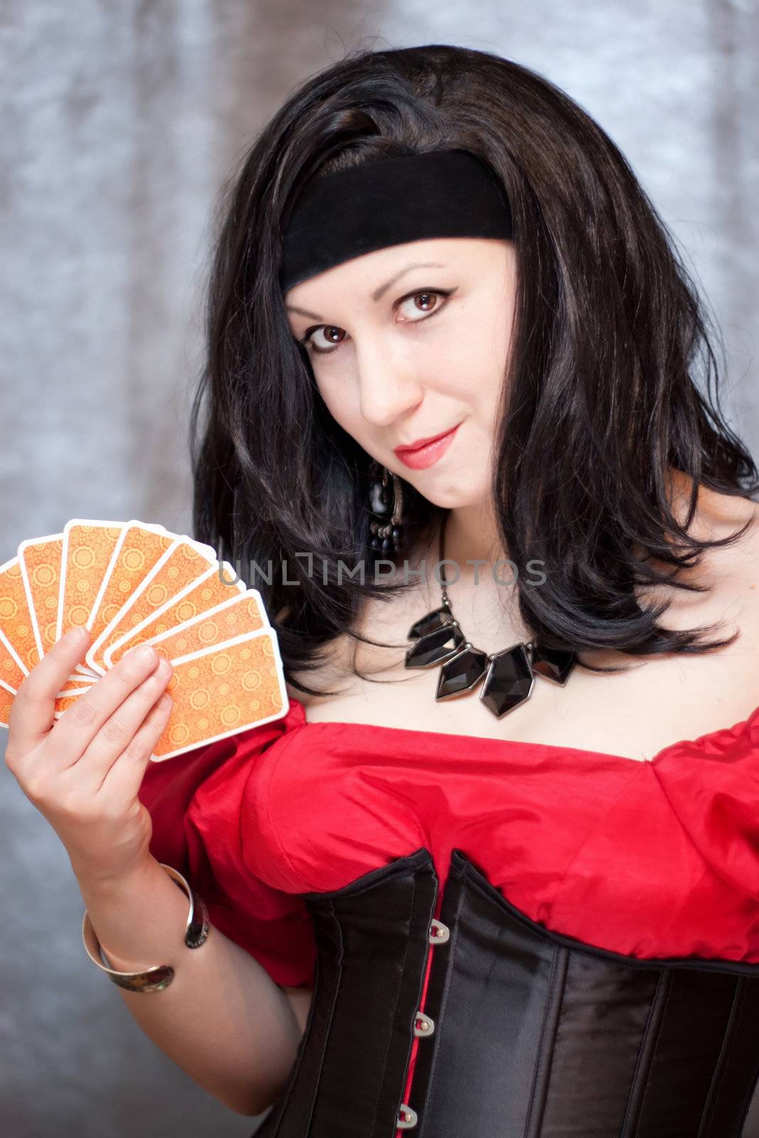 Vertical portrait of gypsy woman with cards