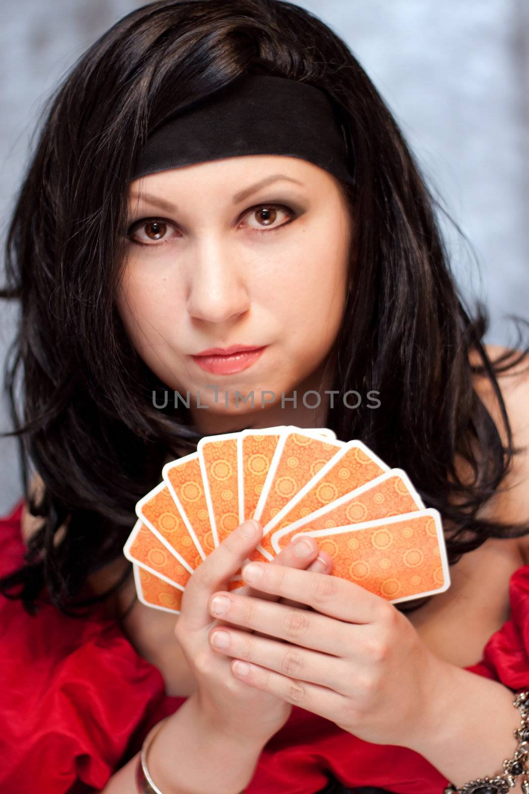 Vertical portrait of gypsy woman with cards