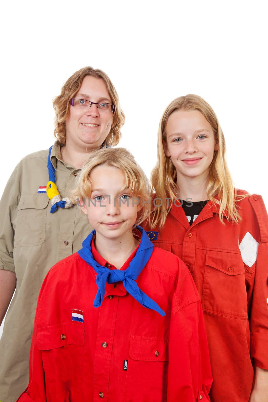 Three Dutch scout girls posing over white background