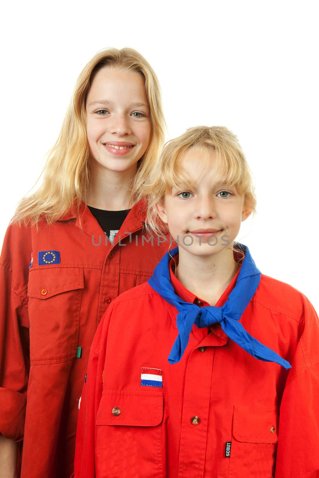 Two Dutch scout girls posing over white background