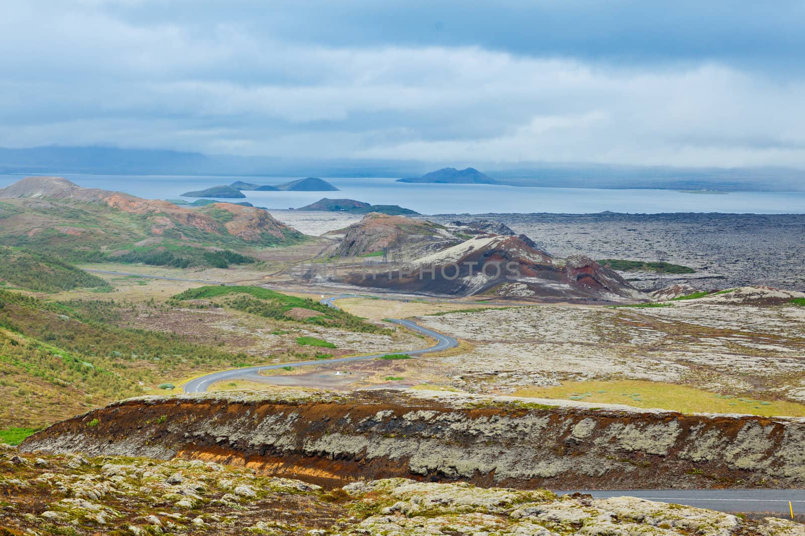 Icelandic landscape with mountains and the road. Nature reserve on the background, Iceland