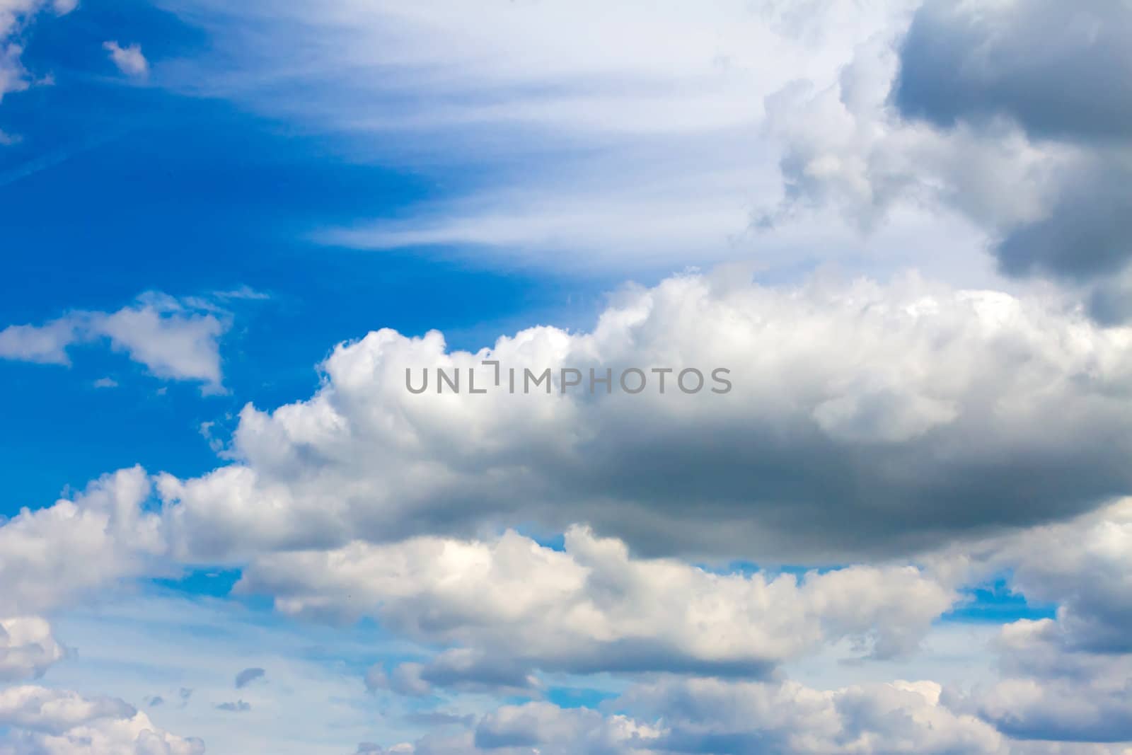 white whispy clouds in a vibrant blue sky