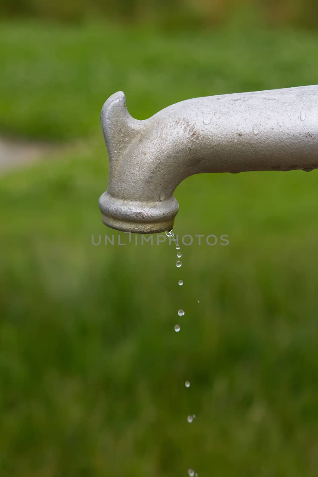 running tap outdoors showing water flowing
