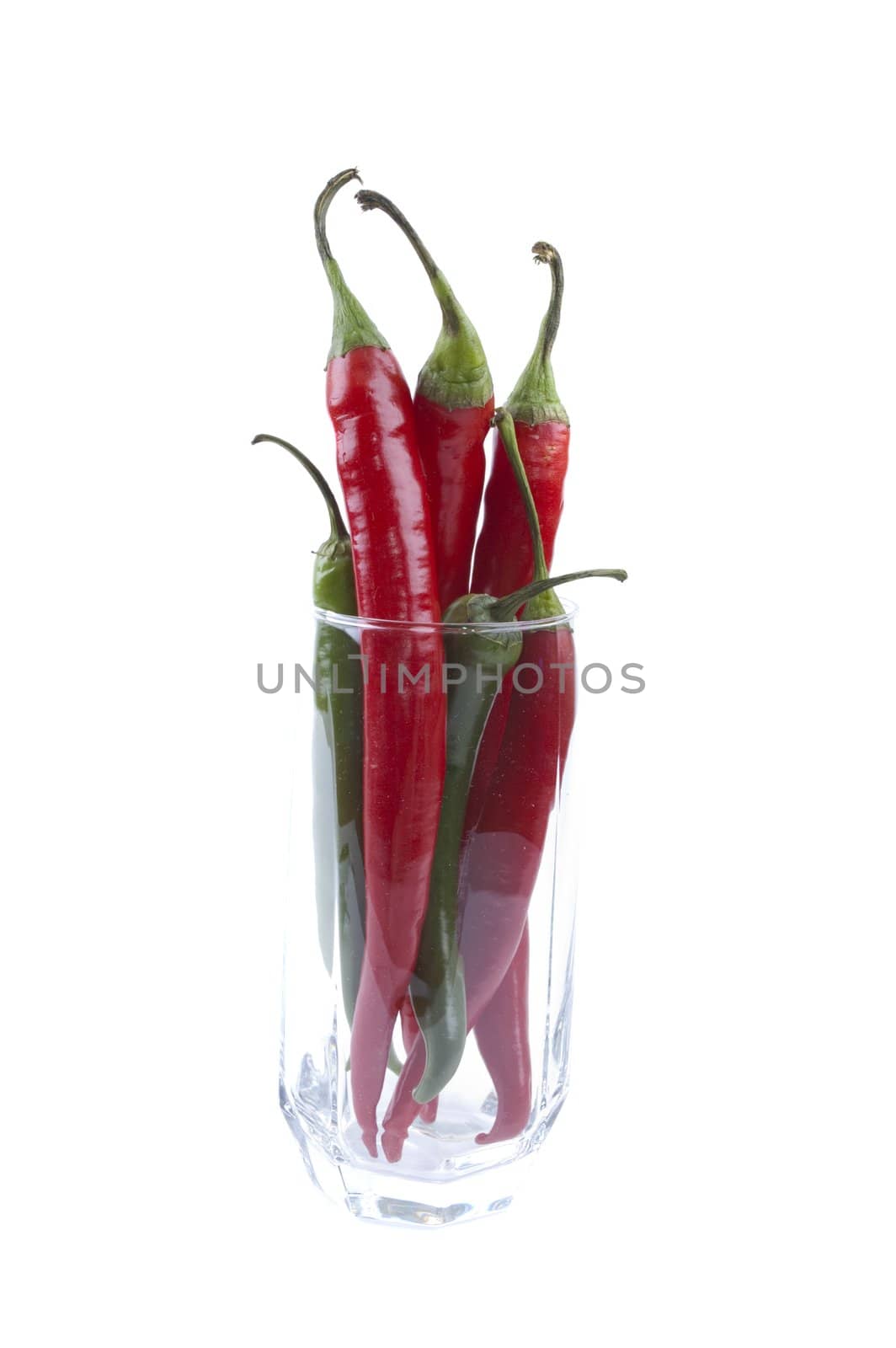 pack of chili peppers in a glass isolated