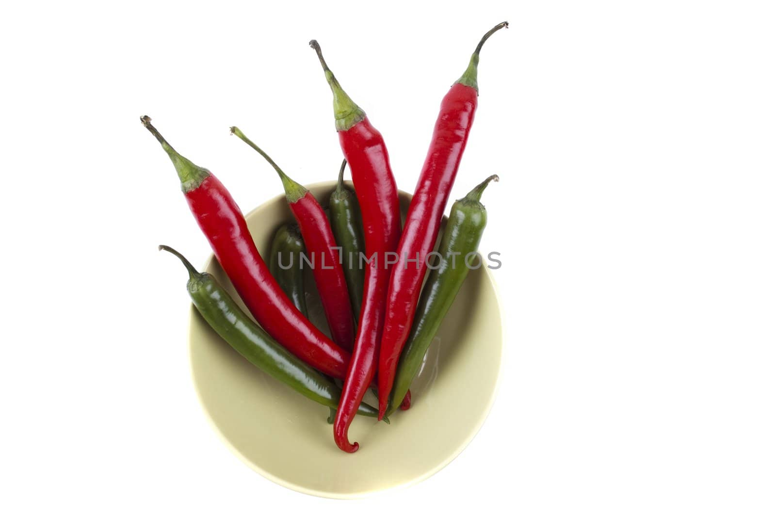 isolated pack of top chili peppers on the plate by Triphka