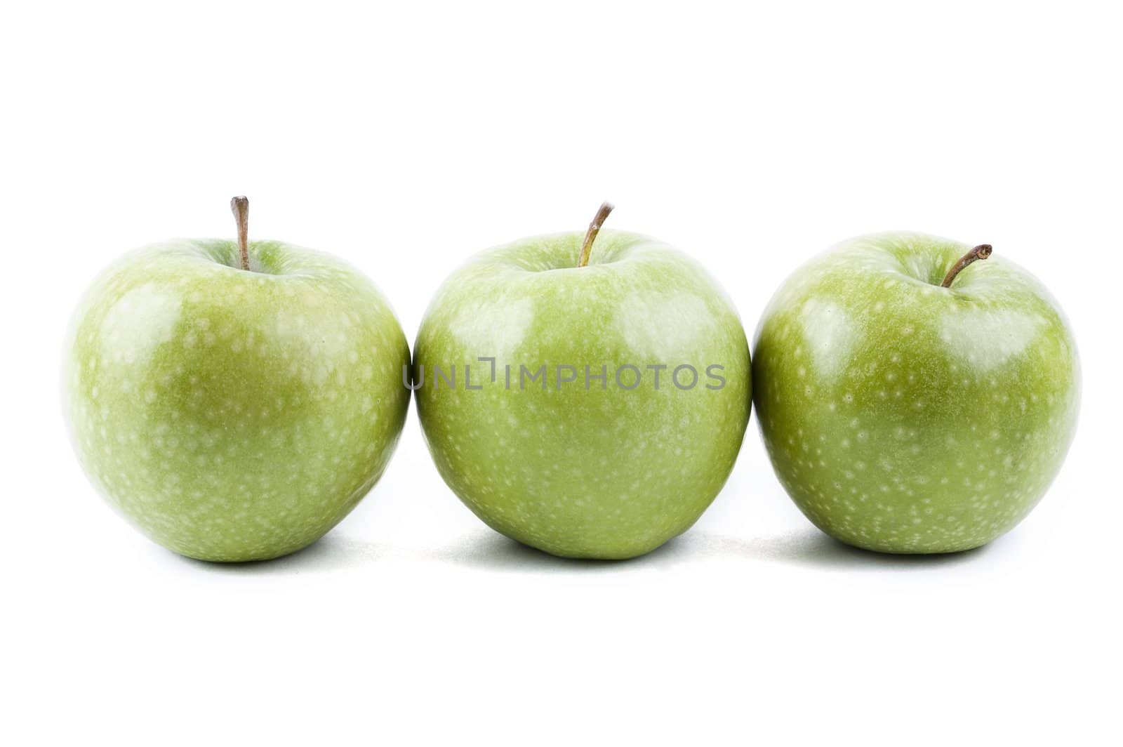 isolated three green apples in a row by Triphka