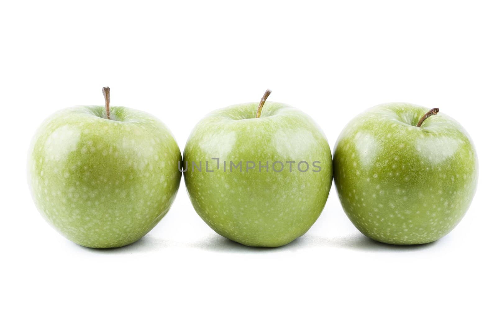 isolated three green apples in a row