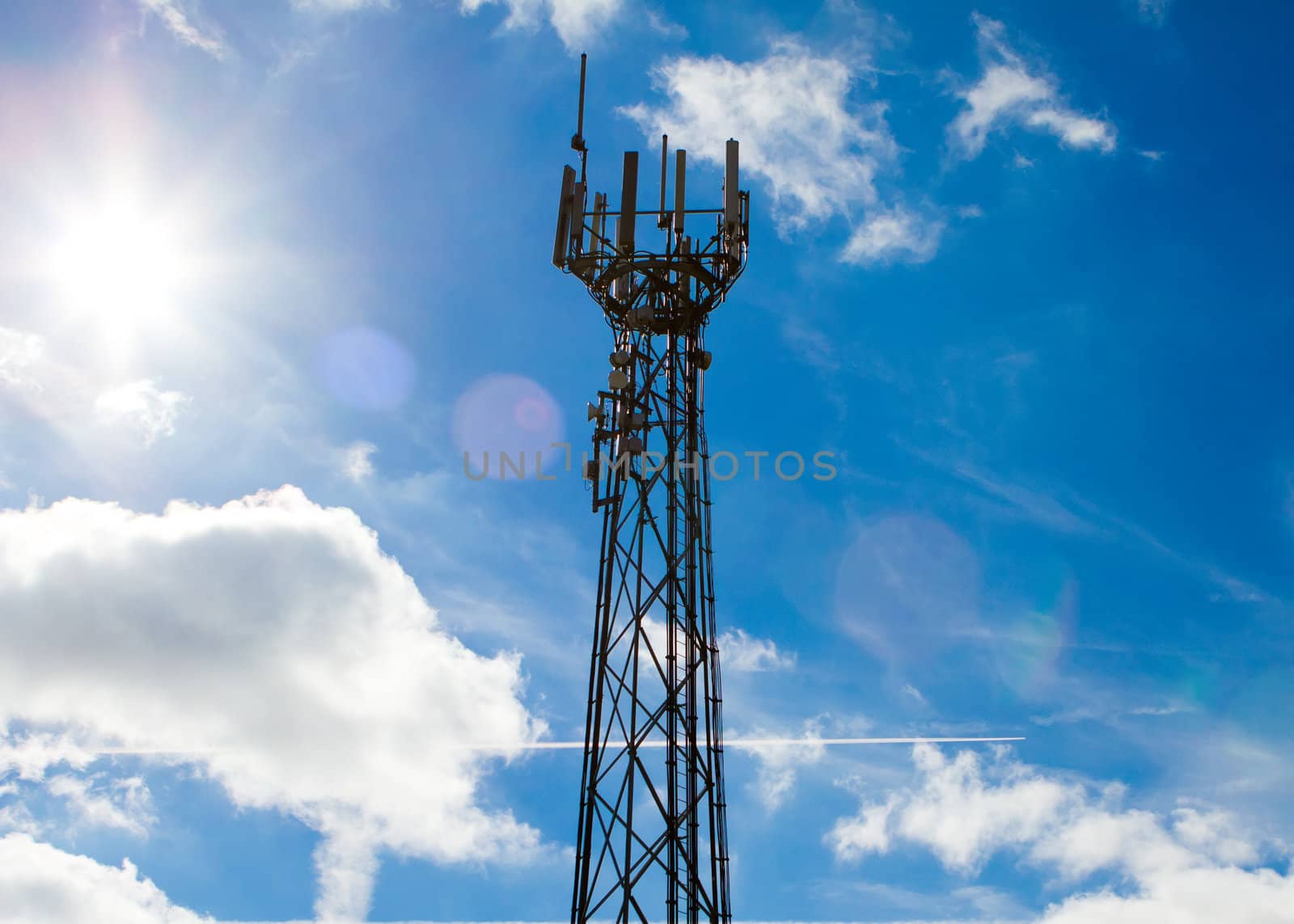 Mobile phone mast with a blue sky behind