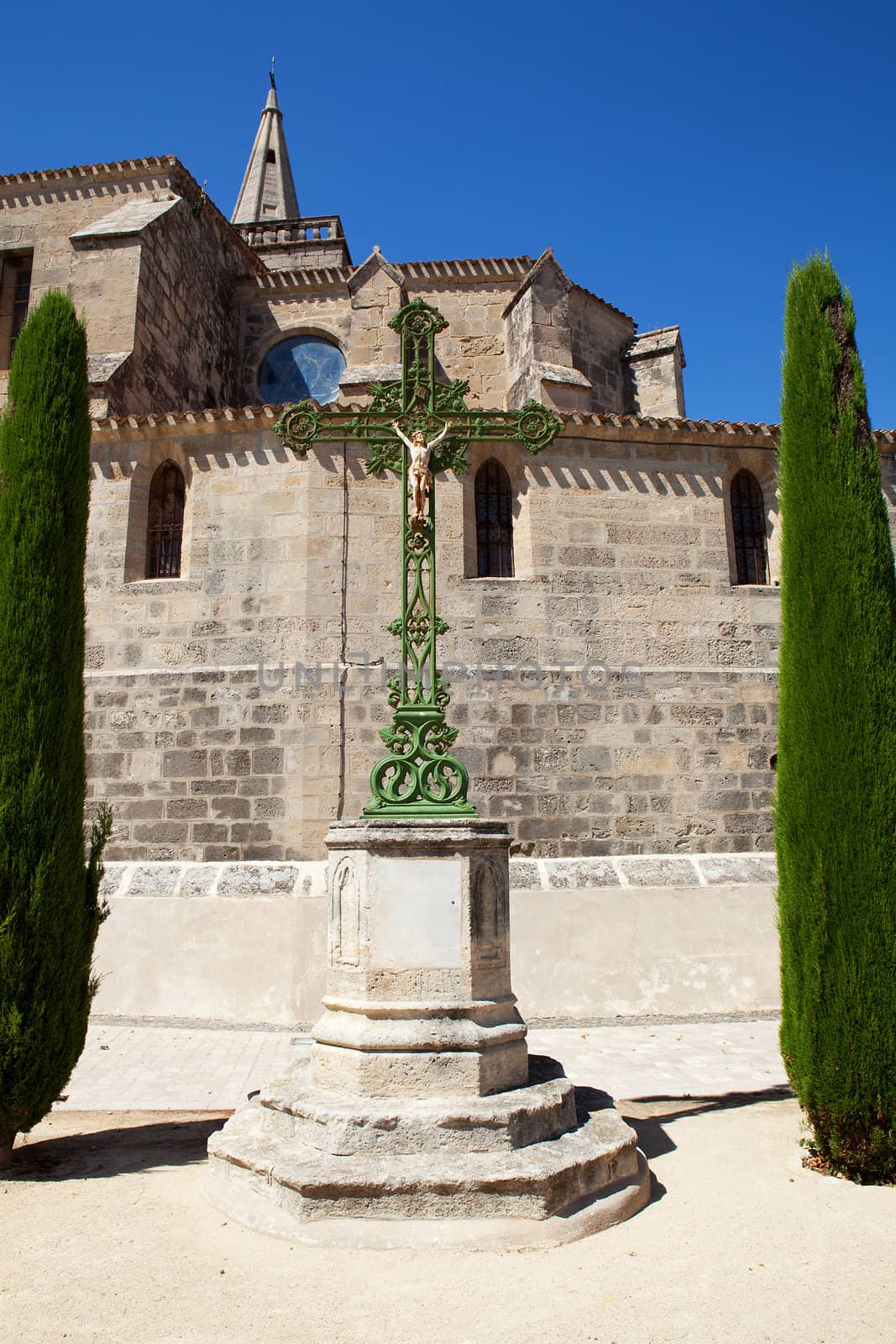 Typical French church with cross against blue sky