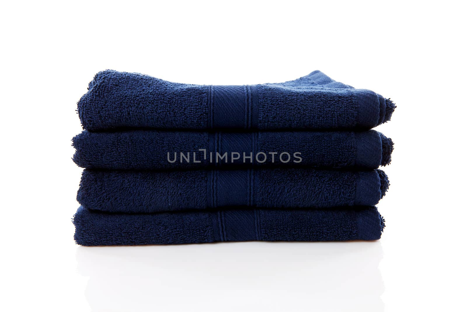 pile of blue towels over white background