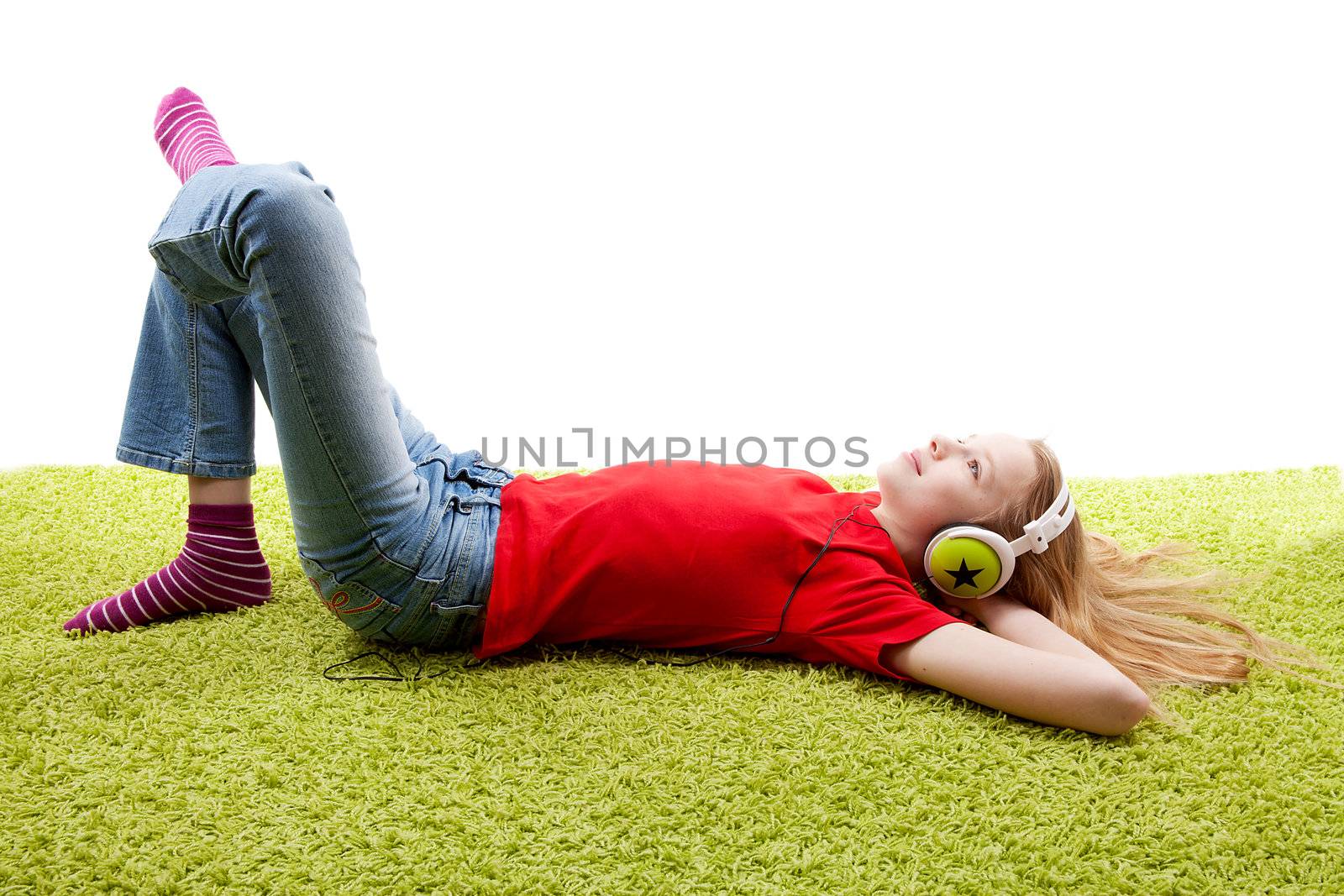 girl is listening to music with headphones on over white background